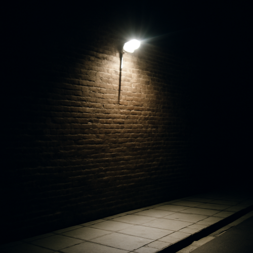 Glare from a single bright luminaire on a pavement